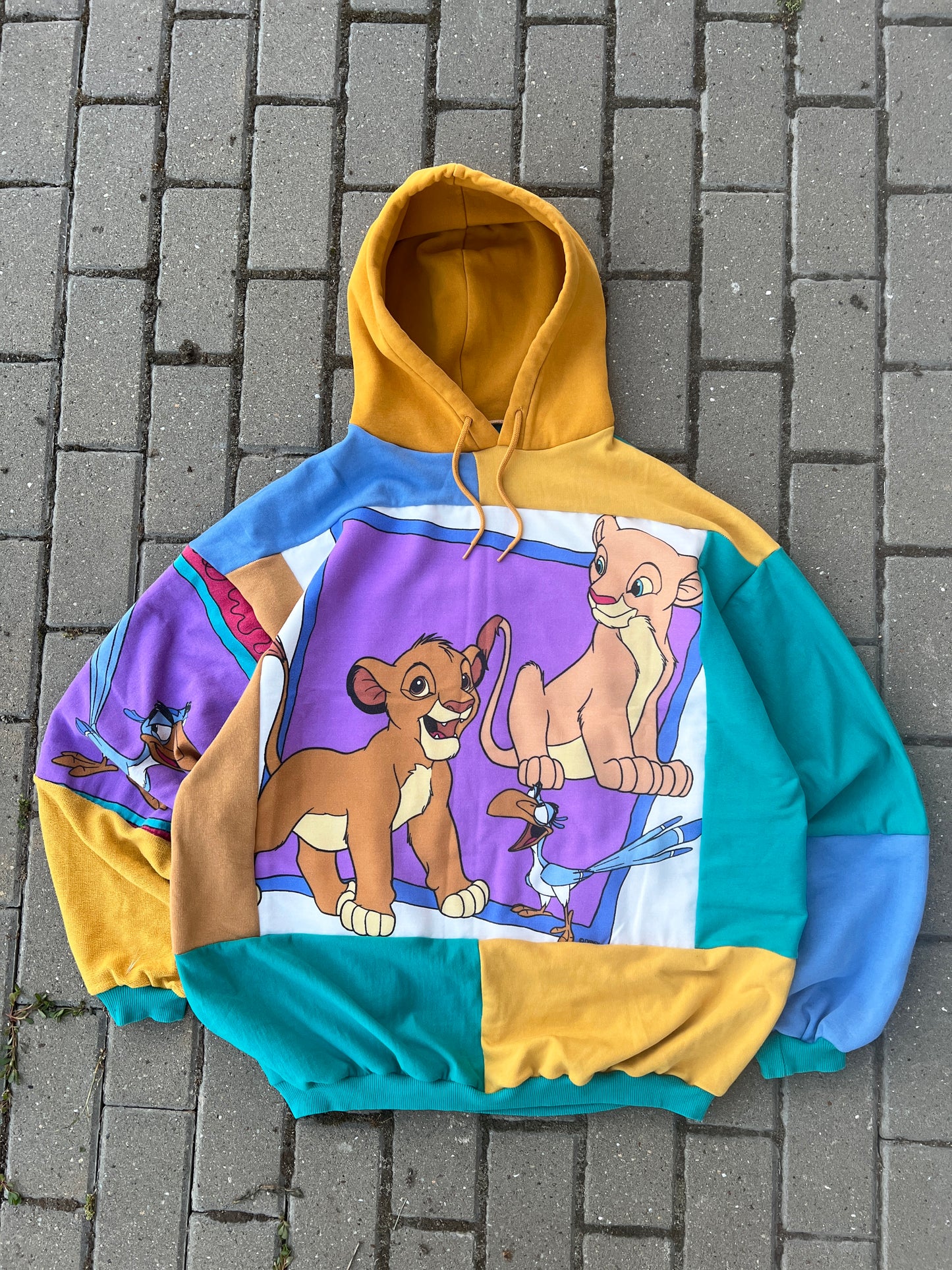 'CAN YOU FEEL THE LOVE TONIGHT' PATCHWORK HOODIE (L)