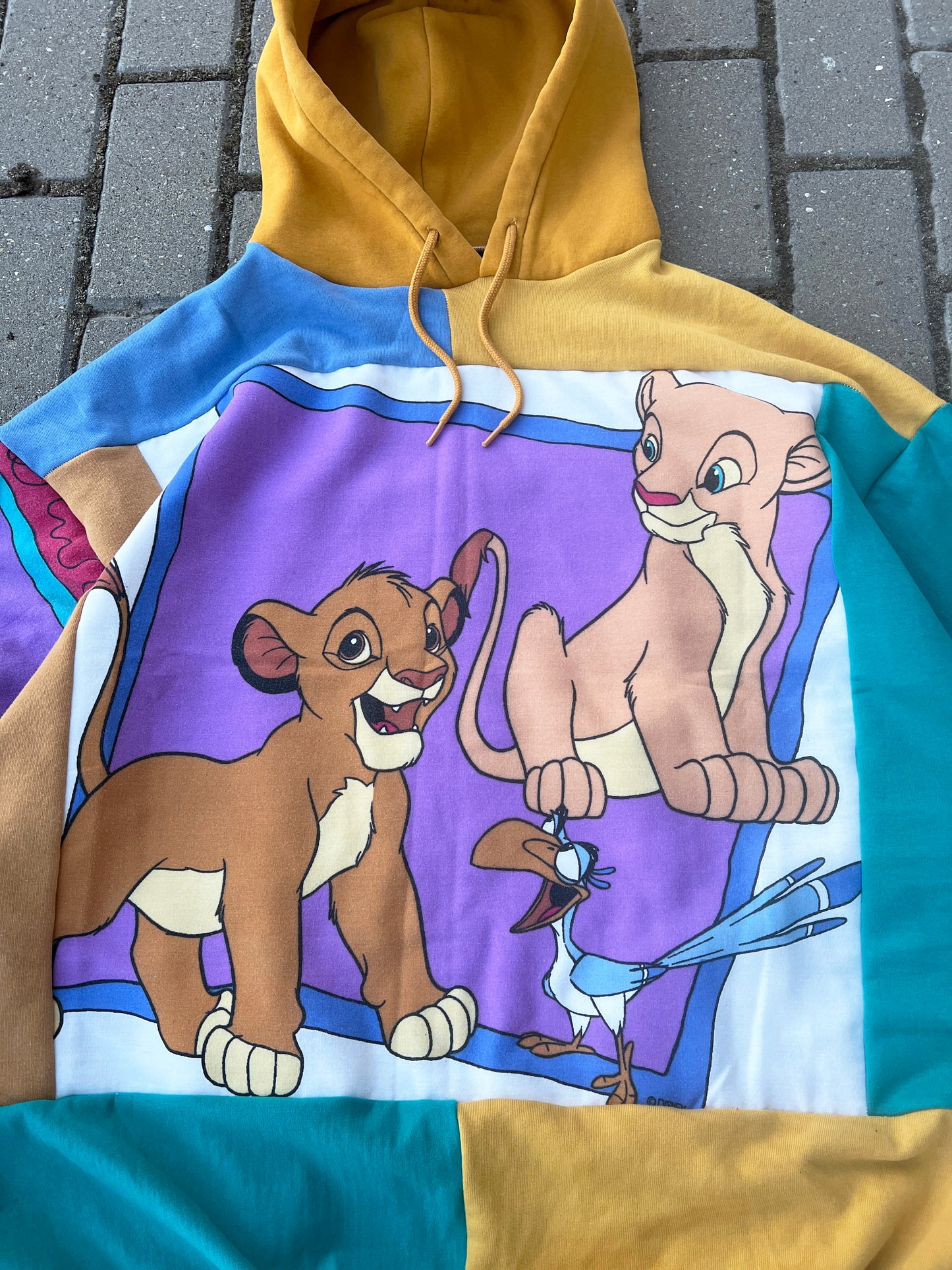 'CAN YOU FEEL THE LOVE TONIGHT' PATCHWORK HOODIE (L)